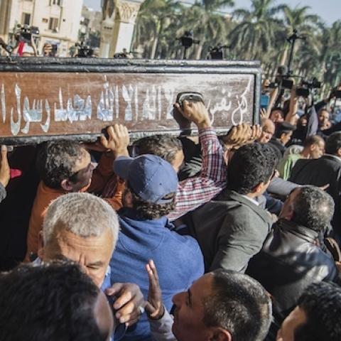 Egyptians mourners carry the coffin of the Egyptian journalist Mohamed Hassanein Heikal during his funeral at the al-Hussein mosque in Cairo on February 17, 2016. (KHALED DESOUKI/AFP/Getty Images)