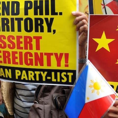 Filipino protesters display placards during a rally against China's claim to areas of the South China Sea, at the Chinese consulate in Manila on June 12, 2014. (JAY DIRECTO/AFP/Getty Images)