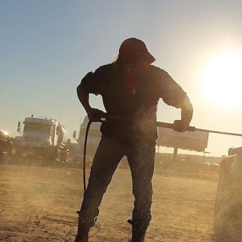 A truck used to carry sand for fracking is washed in a truck stop on February 4, 2015 in Odessa, Texas. (Spencer Platt/Getty Images)