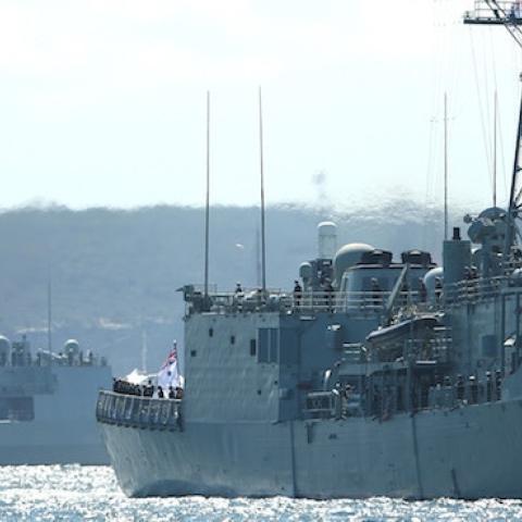 Royal Australian Navy warships HMAS Darwin (R) and HMAS Parramatta enter Sydney Harbour on October 4, 2013 in Sydney, Australia. (Cameron Spencer/Getty Images)