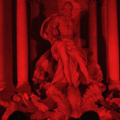 The Trevi fountain is illuminated in red to symbolize blood of persecuted Christians around the world, on April 29, 2016 in Rome. (GABRIEL BOUYS/AFP/Getty Images)