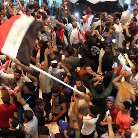 Thousands of protesters storm parliament in Baghdad's Green Zone on April 30, 2016. (Haydar Hadi/Anadolu Agency/Getty Images)