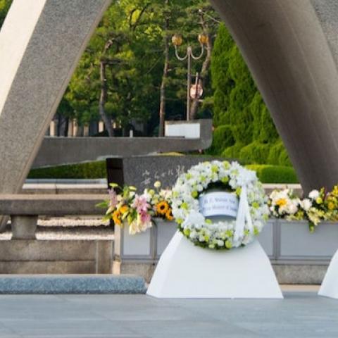 US President Barack Obama (R) and Japanese Prime Minister Shinzo Abe shake hands after laying wreaths at the Hiroshima Peace Memorial Park in Hiroshima on May 27, 2016. (JIM WATSON/AFP/Getty Images)