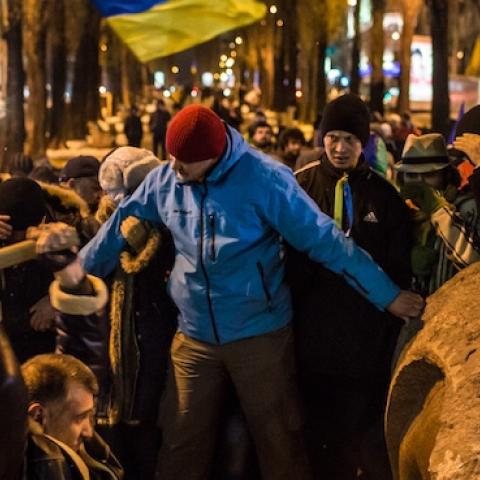 Anti-government protesters destroy a statue of Russian communist revolutionary leader Vladimir Lenin on December 8, 2013 in Kiev, Ukraine. (Brendan Hoffman/Getty Images)