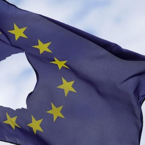 A European Union flag, with a hole cut in the middle, flies at half-mast outside a home on June 24, 2016 in Knutsford, United Kingdom. (Christopher Furlong/Getty Images)