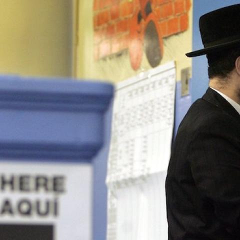 A Hasidic Jewish man prepares to vote November 7, 2006 in the Brooklyn borough of New York City. (Mario Tama/Getty Images)