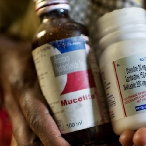 Heer Pardesi, who is 42 years old, holds her antiretroviral drugs for HIV. (Jonas Gratzer/LightRocket via Getty Images)