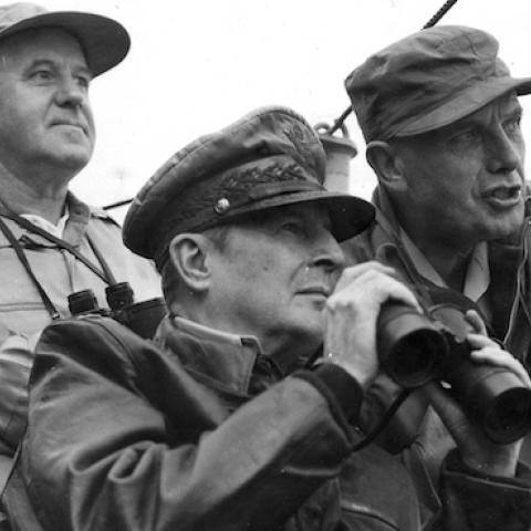 General of the Army Douglas MacArthur (1880 - 1964) (center fore, in leather jacket), and other American military commanders observe the shelling of Inchon during the Korean War, September 1950. (PhotoQuest/Getty Images)