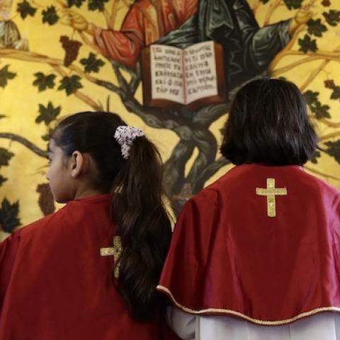 Iraqi Christian children, who fled the violence in the Nineveh province, attend a mass with their mothers at a chuch in Dekwaneh, east of the Lebanese capital Beirut on March 21, 2015. (ANWAR AMRO/AFP/Getty Images)
