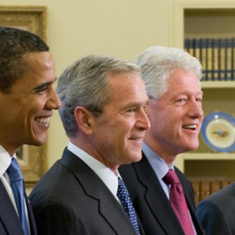 Presidents George H.W. Bush, Barack Obama, George W. Bush, Bill Clinton, and Jimmy Carter in the Oval Office on January 7, 2009. (Photo credit should read SAUL LOEB/AFP/Getty Images)