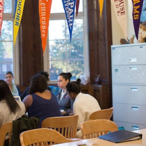 College banners hang in the classroom of teacher Chrys Latham, as she leads a senior advisory period, at Washington Latin Public Charter School, in Northwest Washington, D.C., October 23, 2015. (Allison Shelley/For The Washington Post via Getty Images)