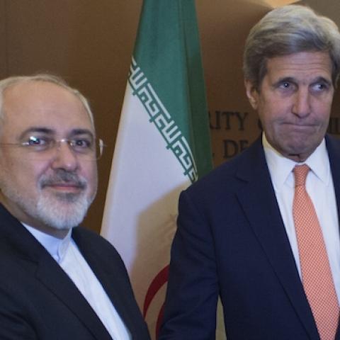 US Secretary of State John Kerry (R) with Iran's Foreign Minister Mohammad Javad Zarif April 19, 2016 at the United Nations in New York. (DON EMMERT/AFP/Getty Images)