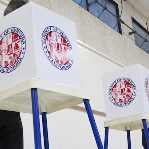 Citizen votes in election booth polling station in a gymnasium in Oak View, California, on November 4, 2014. (Joseph Sohm / Shutterstock.com)