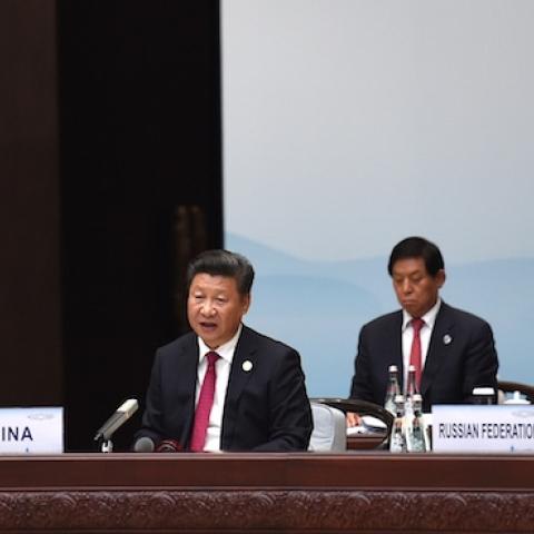 China's President Xi Jinping (C) flanked by US President Barack Obama (L) and Russia's President Vladimir Putin (R) during the opening ceremony of the G20 Summit in Hangzhou on September 4, 2016. (STEPHANE DE SAKUTIN/AFP/Getty Images)