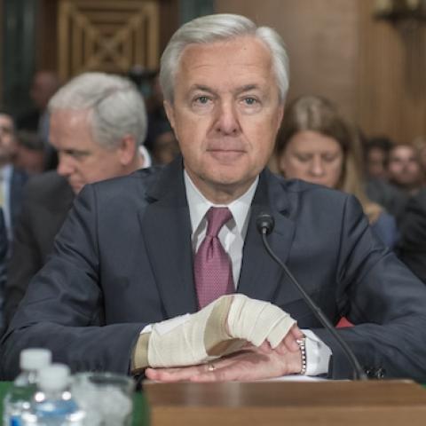 Wells Fargo CEO John Stumpf, center, prepares to testify at a Senate Banking, Housing, and Urban Affairs hearing in Dirksen Building, September 20, 2016. (Tom Williams/CQ Roll Call)