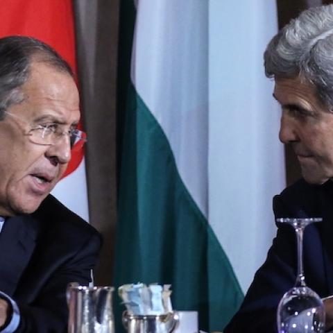 Russia's Foreign Minister Sergei Lavrov (L) and US Secretary of State John Kerry talking during an International Syria Support Group meeting at the Lotte New York Palace Hotel. (Valery Sharifulin\TASS via Getty Images)