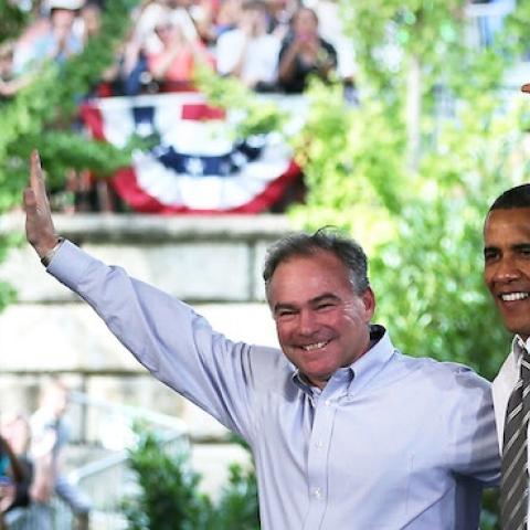 U.S. President Barack Obama (R) and Democratic U.S. Senate candidate and former Virginia Governor Tim Kaine (R) wave to supporters during a campaign event at the Charlottesville nTelos Wireless Pavilion August 29, 2012 in Charlottesville, Virginia. (Alex 