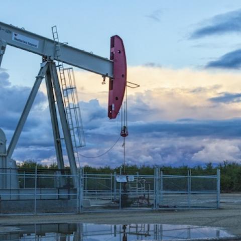 A pump jack and surface water at oil well and fracking site in Shafter, over the Monterey Shale, San Joaquin Valley, California. (Citizens of the Planet/Education Images/UIG via Getty Images)