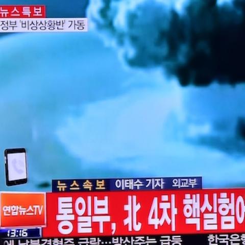 People watch a news report on North Korea's first hydrogen bomb test at a railroad station in Seoul on January 6, 2016. (JUNG YEON-JE/AFP/Getty Images)