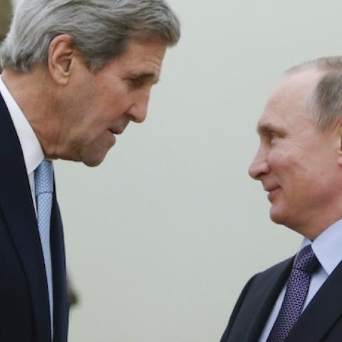 Russian President Vladimir Putin (R) shakes hands with US Secretary of State John Kerry during a meeting at the Kremlin in Moscow on December 15, 2015. (SERGEI KARPUKHIN/AFP/Getty Images)