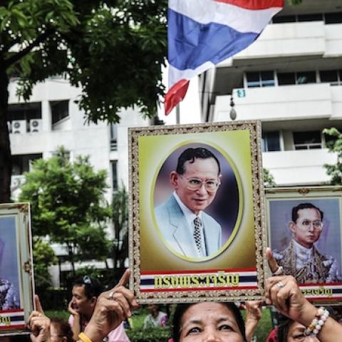 People hold portraits of Thai King Bhumibol Adulyadej at Siriraj hospital, on June 13, 2016 in Bangkok, Thailand. (Dario Pignatelli/Getty Images)