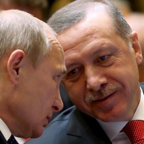 Turkish President Recep Tayyip Erdogan (R) speaks with Russian President Vladimir Putin (L) prior to a joint press conference at Turkey's Presidential Palace in Ankara, Turkey on December 01, 2014. (Kayhan Ozer/Anadolu Agency/Getty Images)