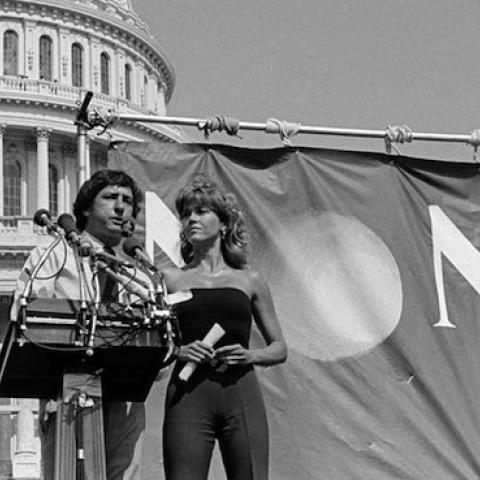 American political activist Tom Hayden stands with his wife, actress Jane Fonda, on the steps of the US Capital as he speaks at a No Nukes rally, Washington DC, May 6, 1979. (Allan Tannenbaum/Getty Images)