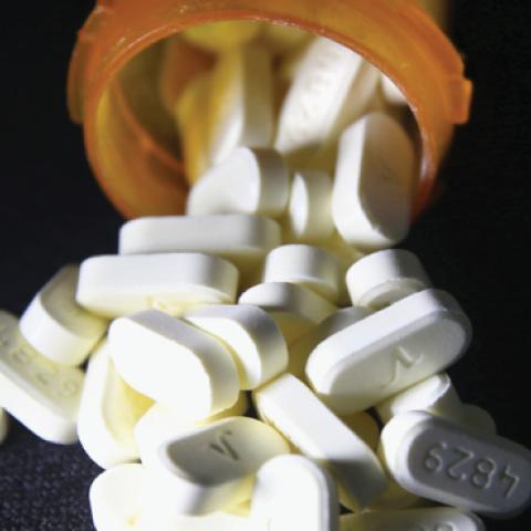 Oxycodone pain pills prescribed for a patient with chronic pain lie on display on March 23, 2016 in Norwich, CT. (John Moore/Getty Images)