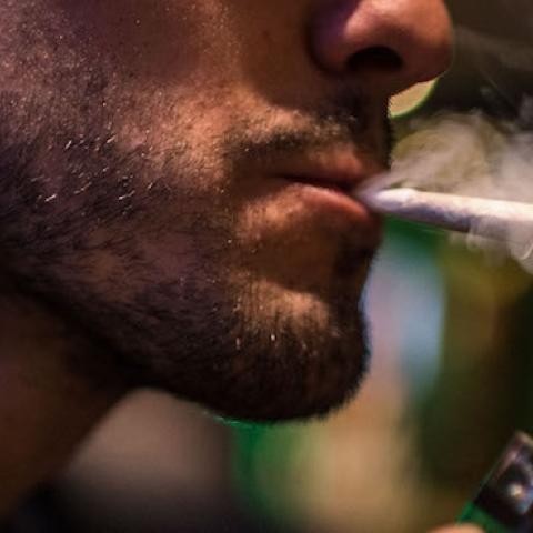 A man smokes a marijuana joint in a cannabis club on August 22, 2014 in Barcelona, Spain. (David Ramos/Getty Images)