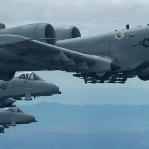 Three A-10 Thunderbolt II aircraft fly in formation over Tucson, Ariz., during an air refueling training mission, April 14, 2006. (Senior Airman Christina D. Ponte/DefenseLINK/Released)