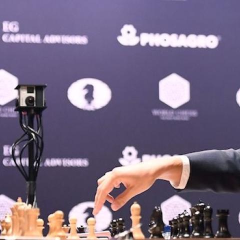 Chess grandmaster and current world chess champion Magnus Carlsen (L) of Norway with challenger Sergey Karjakin of Russia during their World Chess Championship 2016 round 1 match in New York, November 11, 2016. (JEWEL SAMAD/AFP/Getty Images)