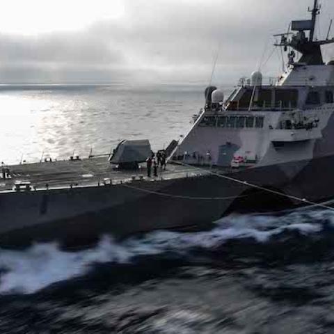 The littoral combat ship USS Freedom (LCS 1) pulls alongside USS John C. Stennis (CVN 74) off the coast of Southern California, April 28, 2015. (U.S. Navy Photo by Mass Communication Specialist 3rd Class Ignacio D. Perez/ Released)