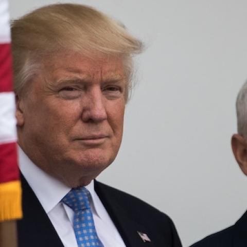 President-elect Donald Trump and vice president-elect Mike Pence listen to a question from the press regarding the musical 'Hamilton' before their meeting with investor Wilbur Ross at Trump International Golf Club, November 20, 2016 in Bedminster Township