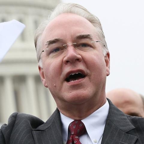 U.S. Rep. Tom Price (R-GA) tears a page from the national health care bill during a press conference at the U.S. Capitol March 21, 2012 in Washington, DC. (Win McNamee/Getty Images)