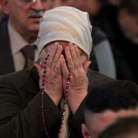 Iraqi Christians attend a Christmas mass at the Catholic Church of Our Lady of Deliverance/Salvation (Sayidat al-Nejat), in central Baghdad, on December 25, 2015. (AHMAD AL-RUBAYE/AFP/Getty Images)