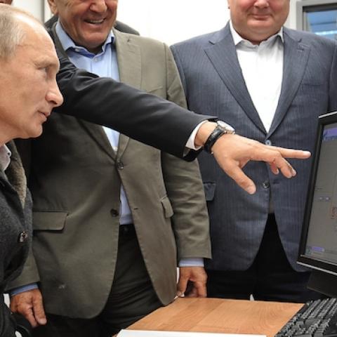 Russian Prime Minister Vladimir Putin (L),Gazprom CEO Alexei Miller (2nd L) and former German chancellor Gerhard Schroeder (3rd L) at the gas compressor station 'Portovaya' outside Vyborg, September 6, 2011. (ALEXEY NIKOLSKY/AFP/Getty Images)