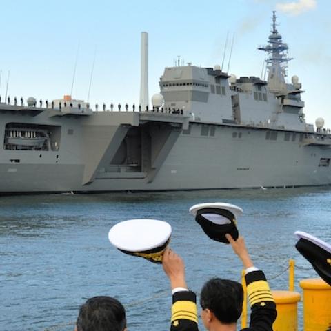 Japan Maritime Self-Defense Force members wave to the Izumo helicopter carrier on March 25, 2015 in Yokohama, Kanagawa, Japan. (The Asahi Shimbun via Getty Images)