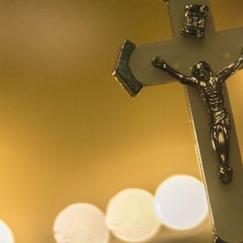 A crucifix is seen hanging as Egyptians attend a candle vigil on December 17, 2016 outside the Saint Peter and Saint Paul Coptic Orthodox Church in Cairo. (KHALED DESOUKI/AFP/Getty Images)