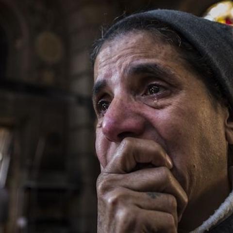 A nun reacts to the scene of a bomb explosion at the Saint Peter and Saint Paul Coptic Orthodox Church on December 11, 2016, in Cairo's Abbasiya neighbourhood. (KHALED DESOUKI/AFP/Getty Images)