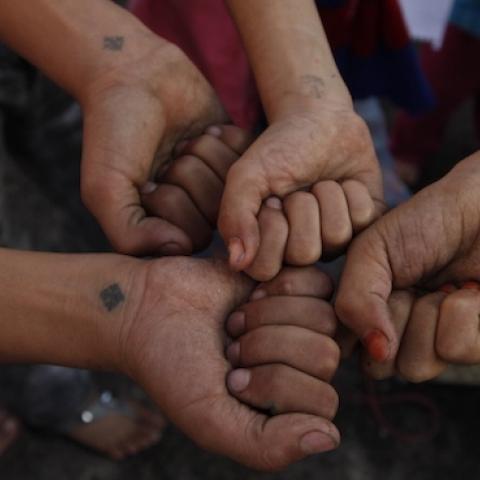 Atef's grandchildren present on their right wrist the tattoo of a blue cross, a sign of their belonging to the Copts of Egypt, Cairo, November 9, 2010. (Alvaro Canovas/Paris Match via Getty Images)