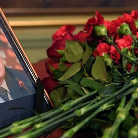 Flowers are placed in front of a portrait of Russian Ambassador to Turkey Andrei Karlov in the Foreign Ministry in Moscow on December 20, 2016, a day after his assassination in the Turkish capital. (NATALIA KOLESNIKOVA/AFP/Getty Images)