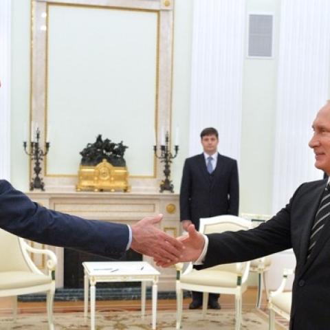 Russian President Vladimir Putin (R) greets his Syrian counterpart Bashar al-Assad (L) during a meeting at the Kremlin in Moscow on October 20, 2015. (ALEXEY DRUZHININ/AFP/Getty Images)