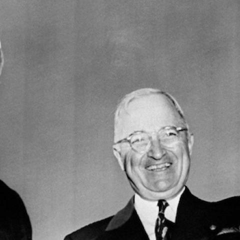 Indian prime minister Pandit Jawaharlal Nehru and US president Harry Truman wave to journalists upon the arrival on the Washington airport of the Indian Government chief, October 13, 1949. (STAFF/AFP/Getty Images)