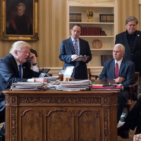 President Donald Trump speaks on the phone with Russian President Vladimir Putin in the Oval Office of the White House, January 28, 2017 in Washington, DC. (Drew Angerer/Getty Images)