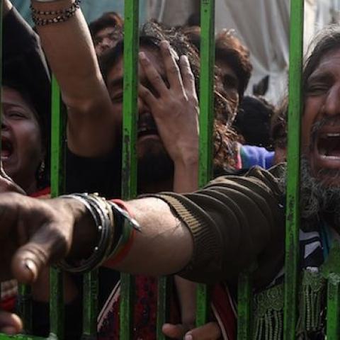 Pakistani devotees gather outside the shrine of 13th century Muslim Sufi saint Lal Shahbaz Qalandar a day after a bomb blew up at the shrine in the town of Sehwan in Sindh province, February 17, 2017. (ASIF HASSAN/AFP/Getty Images)