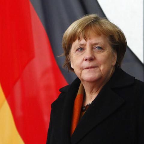 German Chancellor Angela Merkel waits for the Italian Prime Minister Paolo Gentiloni before they review a guard of honor upon Gentilon's arrival at the Chancellery on January 18, 2017 in Berlin, Germany. (Michele Tantussi/Getty Images)