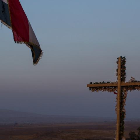 A cross is seen on a hillside overlooking the NPU (Nineveh Plain Protection Units) checkpoint on November 8, 2016 in Qaraqosh, Iraq. (Chris McGrath/Getty Images)