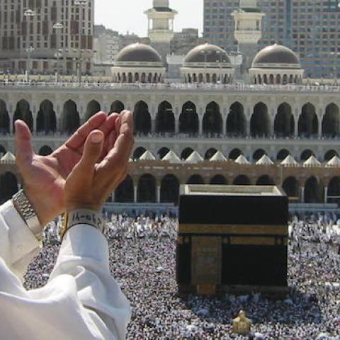 Supplicating Pilgrim at Masjid Al Haram, Mecca, Saudi Arabia, February 13, 2003 (Ali Mansuri/Wikimedia)