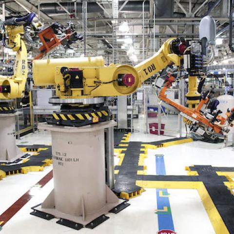 Robots at the Fiat Chrysler Automobiles US Warren Stamping Plant are shown January 22, 2016 in Warren, Michigan. (Bill Pugliano/Getty Images)