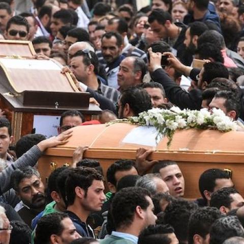 Mourners carry the coffins of the victims of the blast at the Coptic Christian Saint Mark's church in Alexandria on April 10, 2017. (MOHAMED EL-SHAHED/AFP/Getty Images)